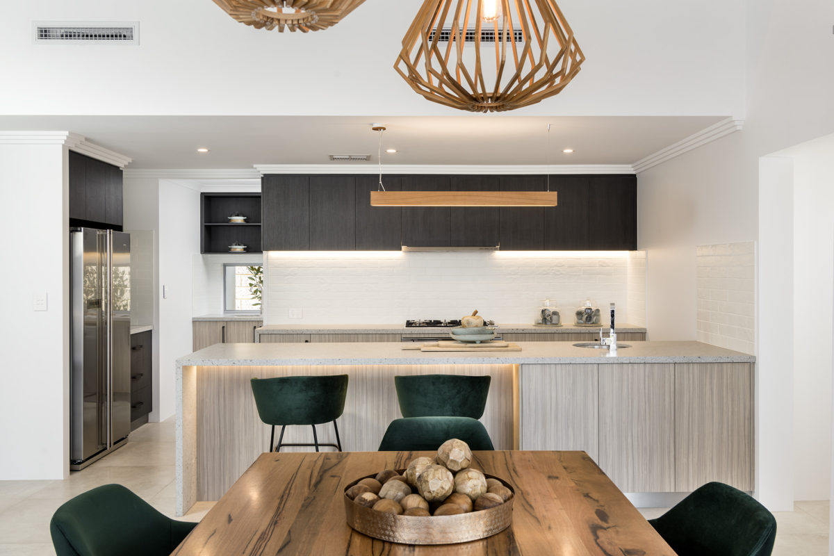 Stylish kitchen in the Bodega Bay home design with timber cabinetry, ideal for open-plan corner block house designs.