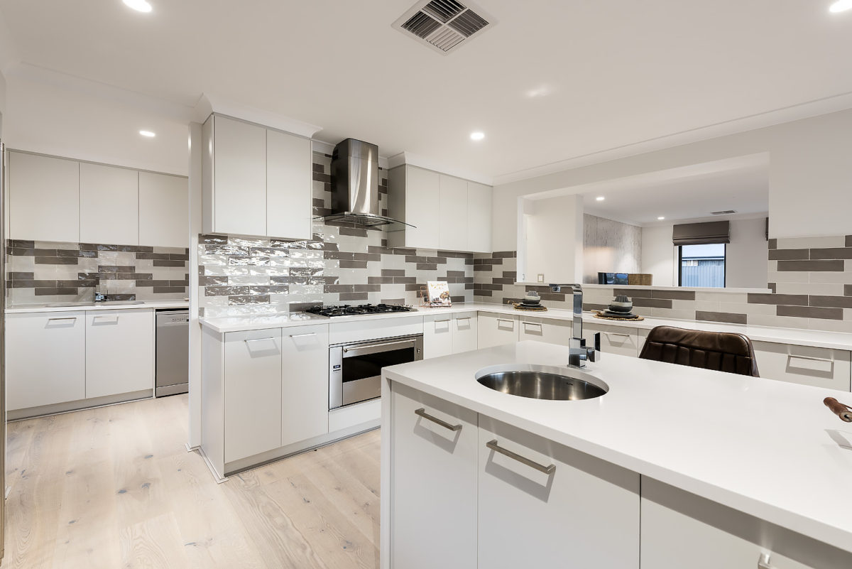 Kitchen area with scullery inside The Colorado, a modern farmhouse design by Plunkett Homes.