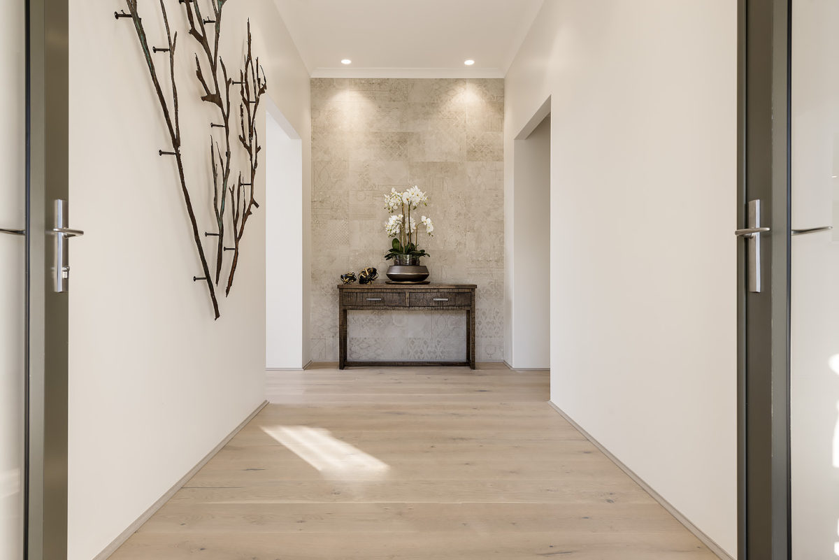 Passageway of The Colorado, a modern farmhouse design by Plunkett Homes.
