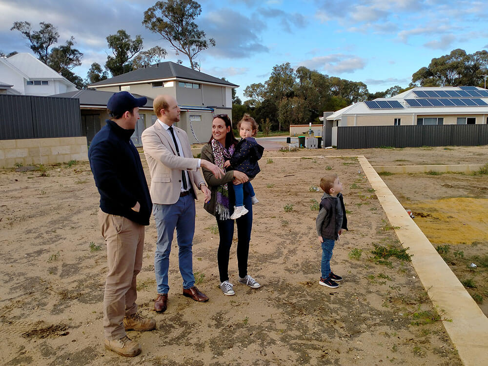 the nederpelt Family discussing their new home with the builder from Plunkett Homes, Perth, WA
