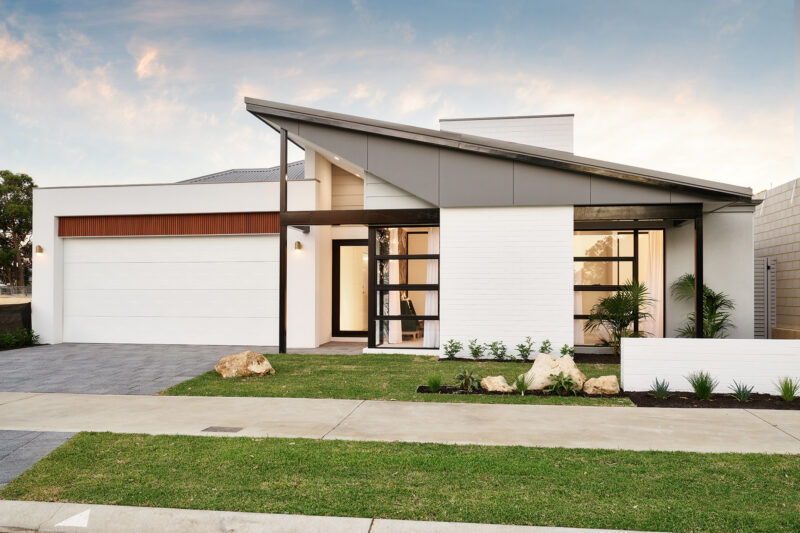 Mid Century facade with pitched skillion roof in the front elevation. The Atomic home design built by Plunkett Homes in Perth, WA.